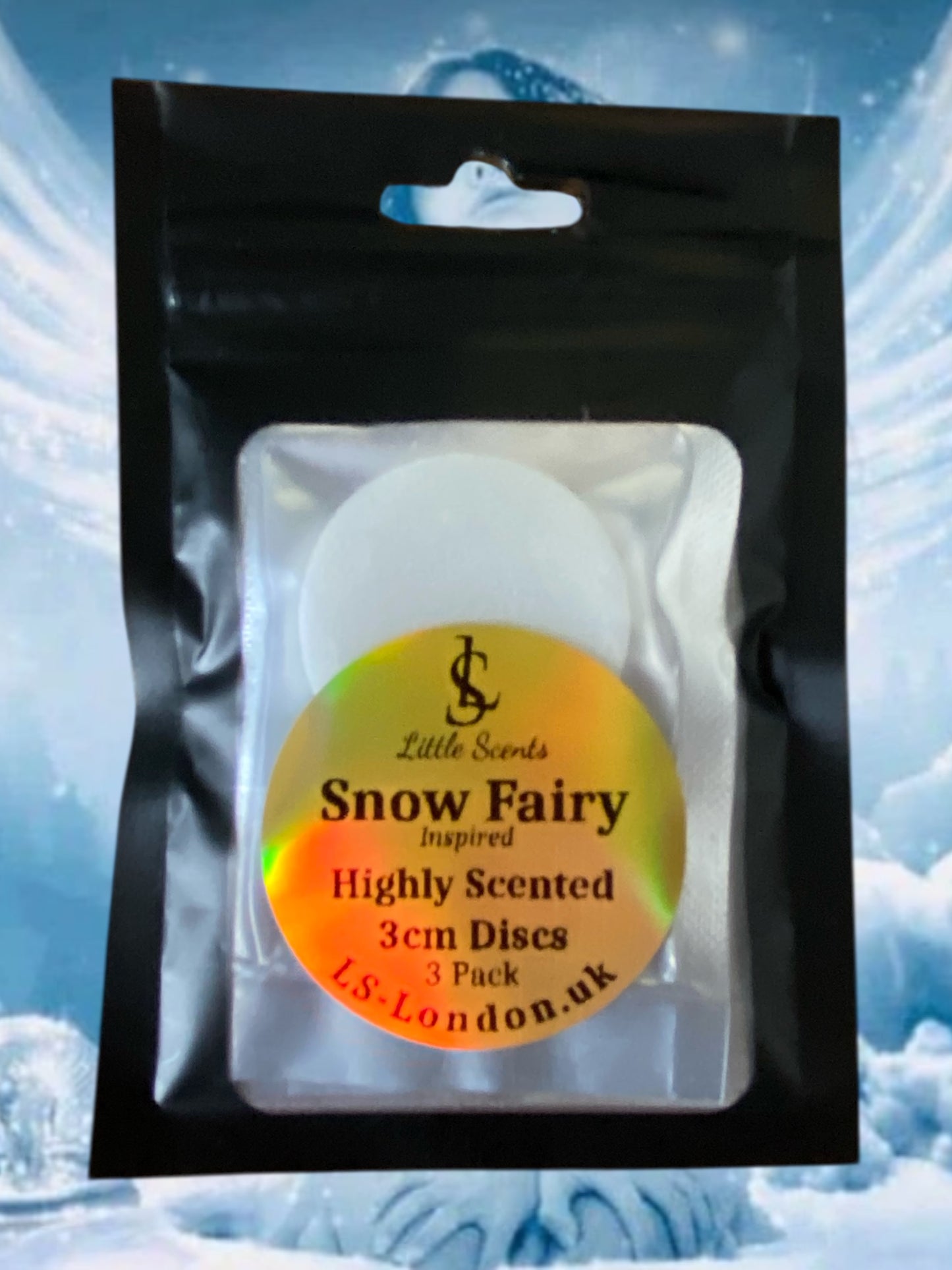 Pack of 'Snow Fairy' highly scented 3cm discs by Little Scents with a snowy background.